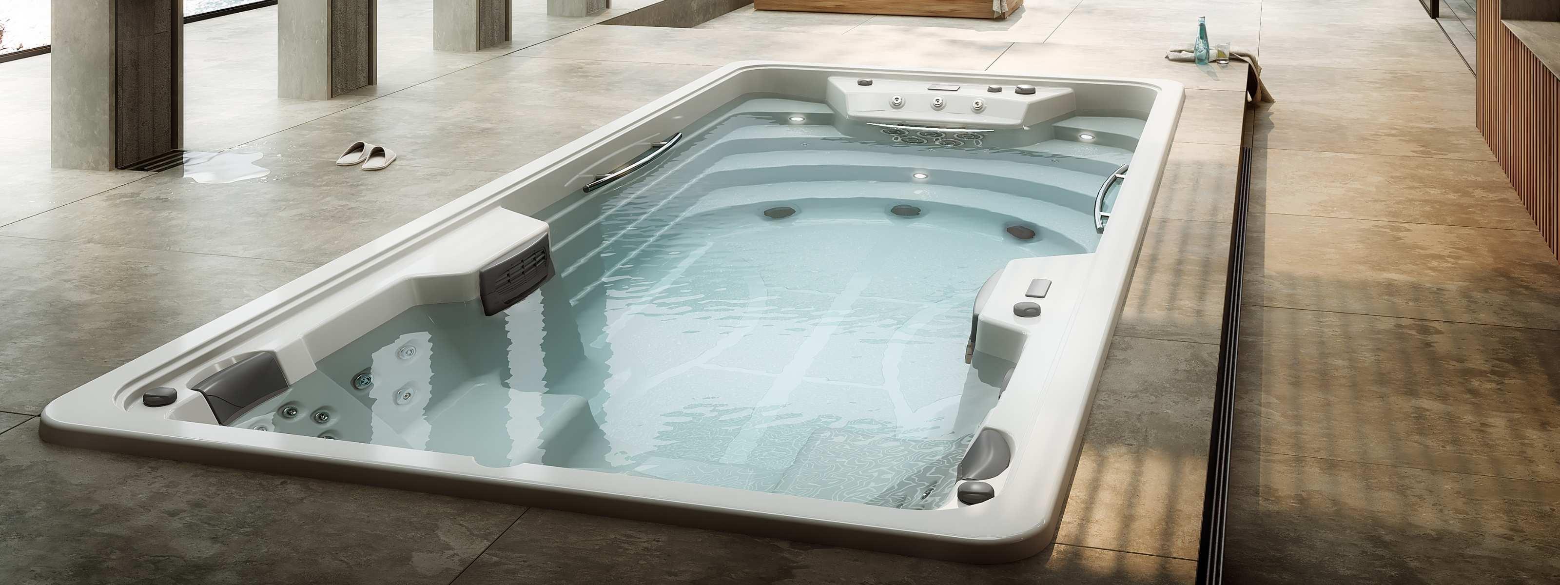 Higold SwimSpa mit moderner Whirlpool-Funktion, eingelassen in stilvolle Terrasse, für luxuriöse Outdoor Wellness