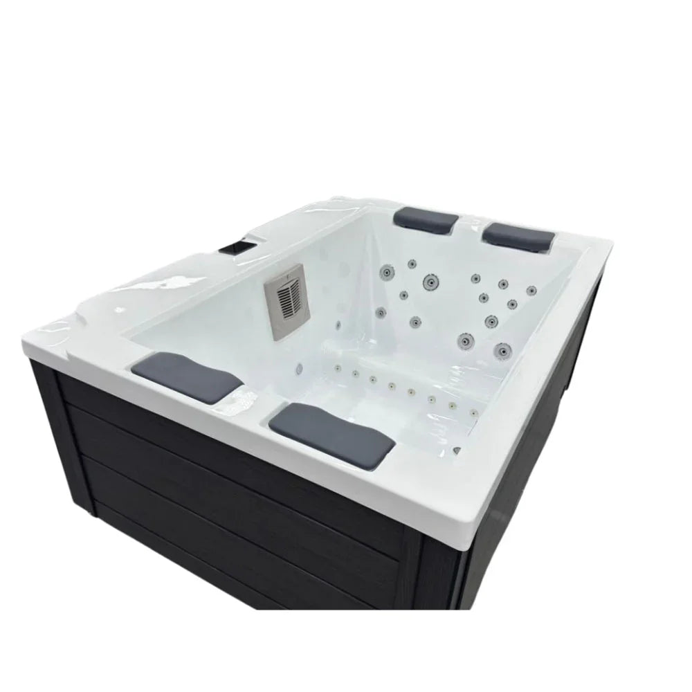 Hochwertiger Outdoor Whirlpool New Wave mit weißen Acrylflächen, Massagedüsen und dunklem Gehäuse